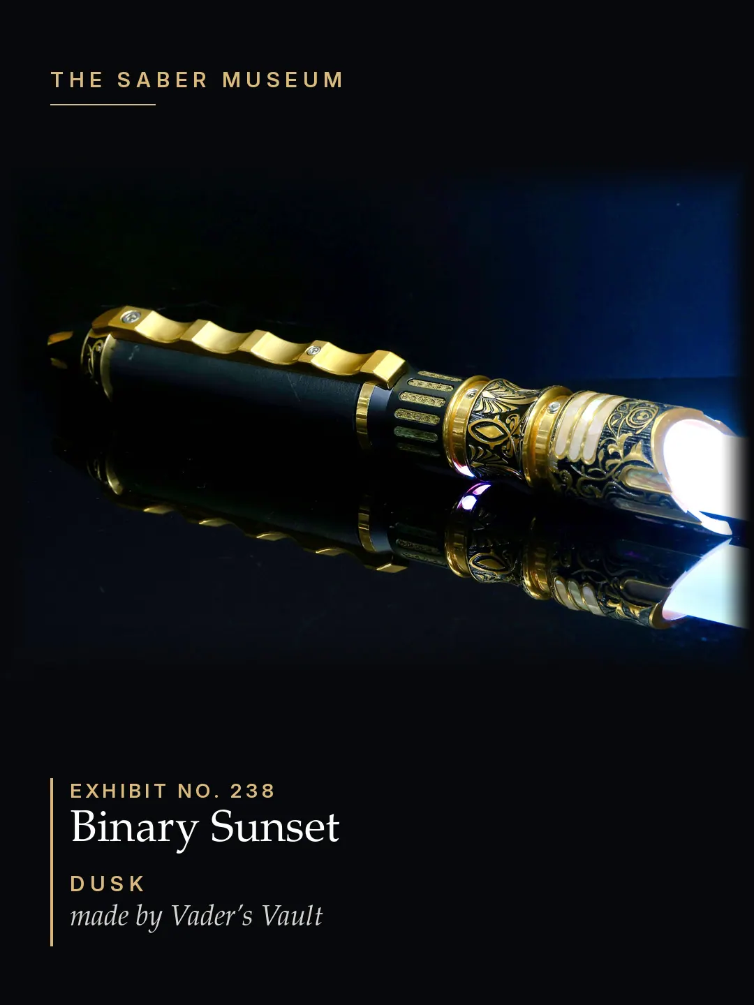 Binary Sunset · Dusk, a customised Vader’s Vault Maelstorm lightsaber: black and gold etched hilt with a sculpted gold spine, white blade ignited, on reflective black glass.